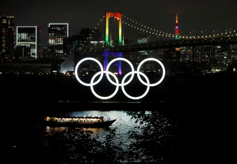 The Rainbow Bridge and Tokyo Tower are illuminated with Olympic