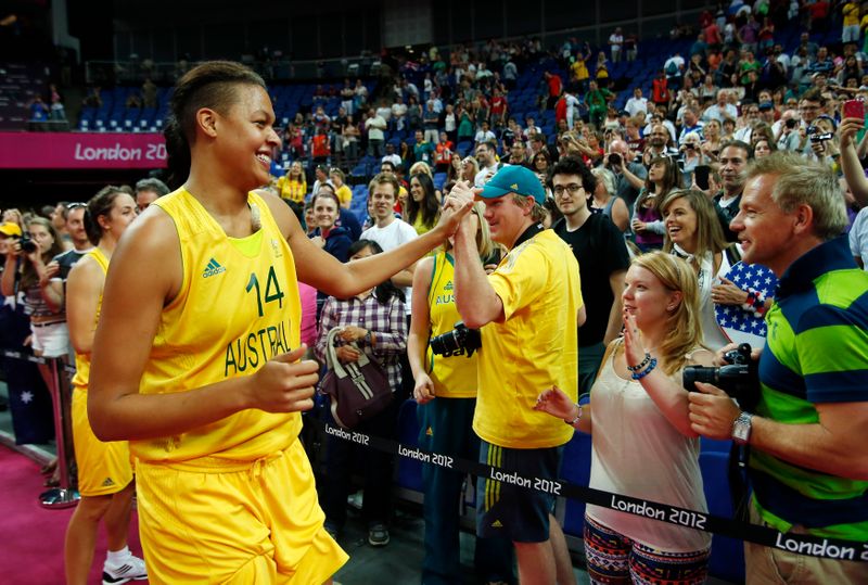Australia’s Cambage celebrates with fans after the women’s bronze medal
