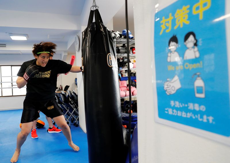 The Wider Image: Japanese boxing nurse has Olympic dream crushed