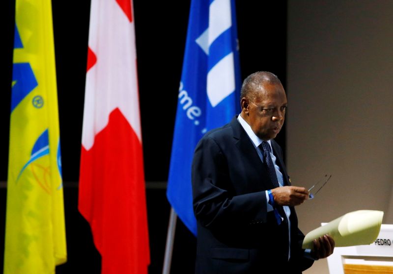 FILE PHOTO: Acting FIFA president Hayatou walks back to his