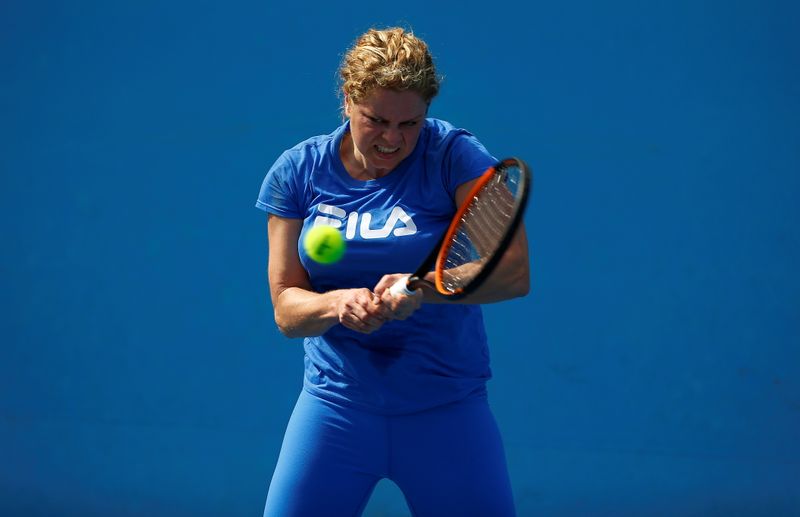 FILE PHOTO: Belgium’s Kim Clijsters hits a shot during a