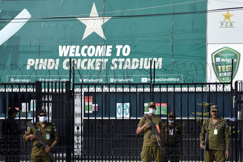 Police officers stand guard outside Rawalpindi Cricket Stadium, in Rawalpindi