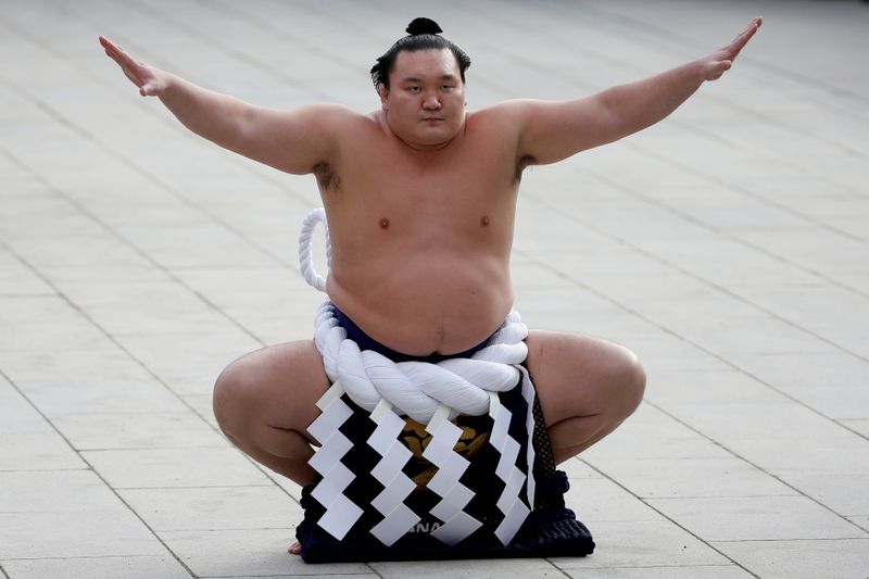 FILE PHOTO: Mongolian-born grand sumo champion yokozuna Hakuho performs the