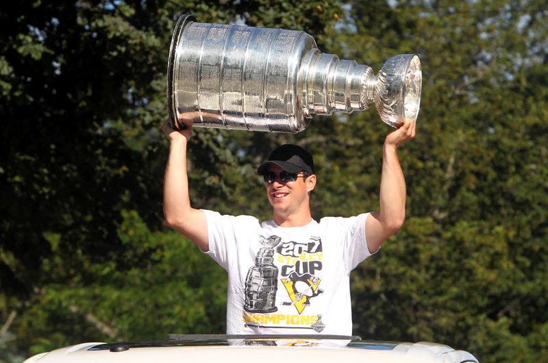 Pittsburgh Penguins captain, Sidney Crosby, hoists the Stanley Cup while
