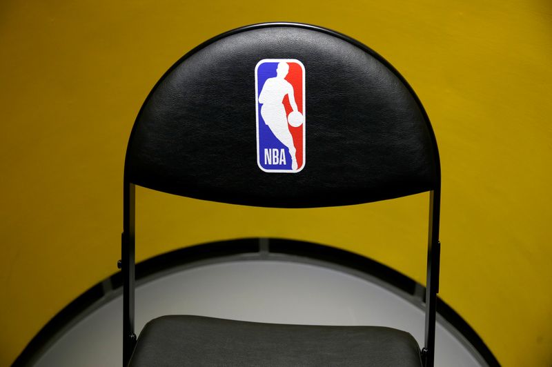 An NBA logo is seen on a chair at an