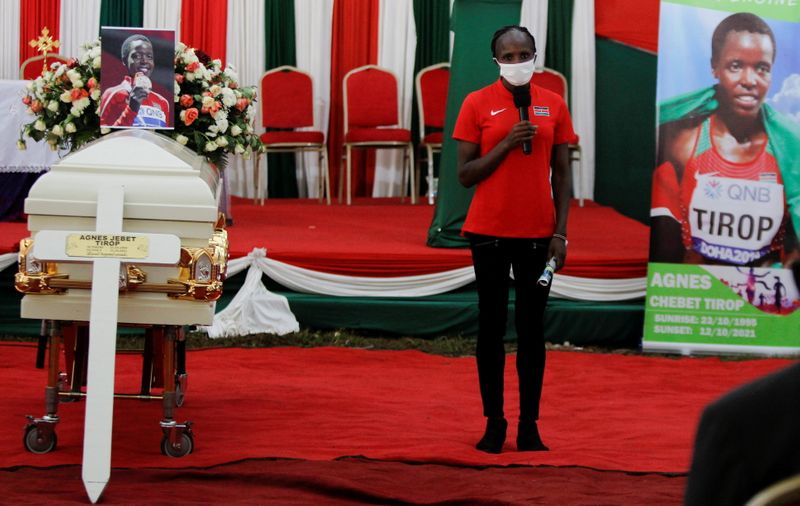Kenyan athlete Hellen Obiri speaks during the funeral service of