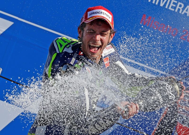 FILE PHOTO: Yamaha MotoGP rider Rossi of Italy sprays champagne