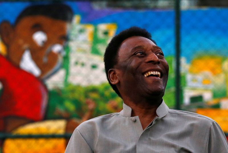 FILE PHOTO: Brazilian soccer legend Pele laughs during the inauguration
