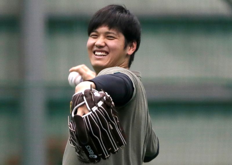 FILE PHOTO: Japanese pitching and hitting star Shohei Ohtani works