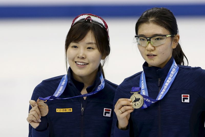 Gold medallist Shim of South Korea and her compatriot, bronze
