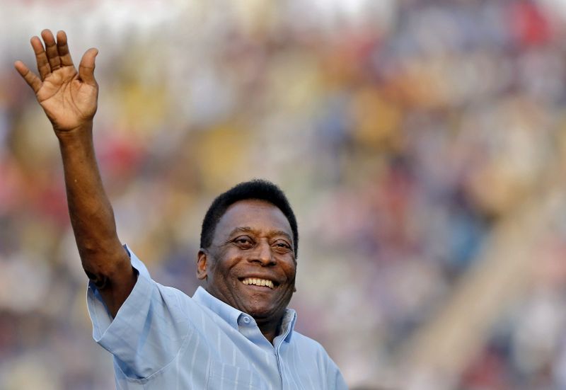 FILE PHOTO: Legendary Brazilian soccer player Pele waves to the