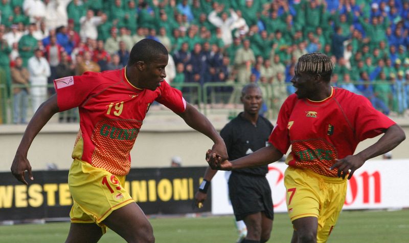 FILE PHOTO: Guinea’s Diawara celebrates his goal with team mate