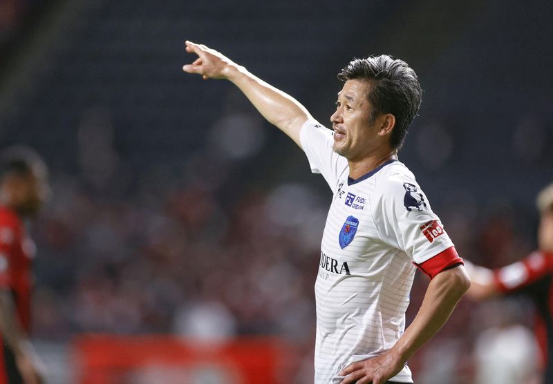 Yokohama FC’s Japanese striker Kazuyoshi Miura gestures during J. League