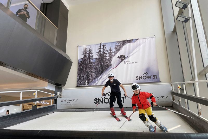 Li Wenxuan, 6, practises skiing at a Snow51 outlet inside