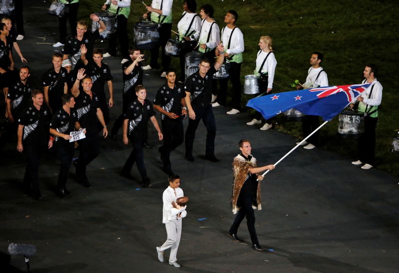 FILE PHOTO: New Zealand’s flag bearer Nick Willis holds the