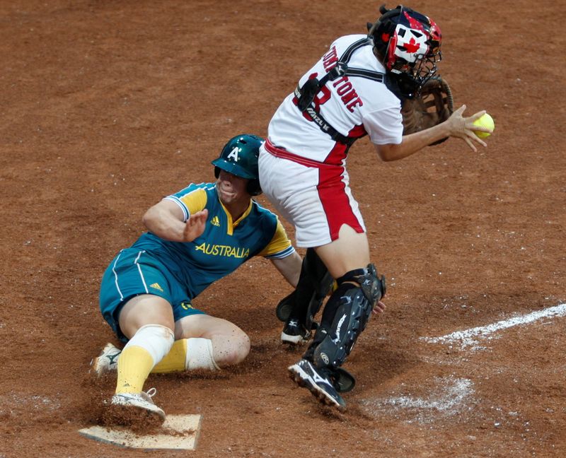 FILE PHOTO: Stacey Porter of Australia (L) scores on a