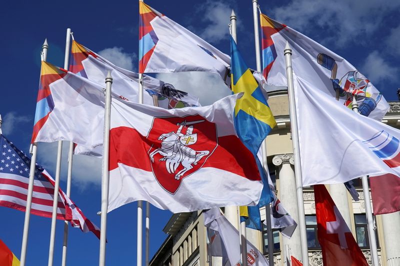 FILE PHOTO: Historical white-red-white flag of Belarus flies in Riga