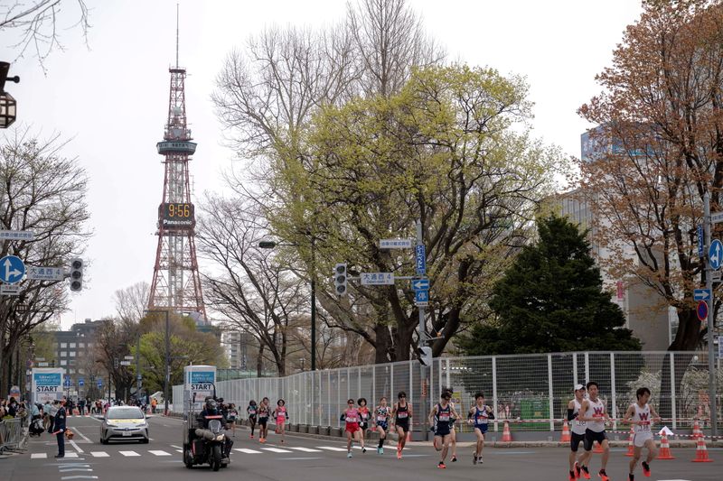 FILE PHOTO: Athletes compete at the half-marathon race which doubles