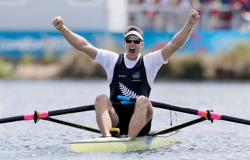 Mahe Drysdale of New Zealand celebrates winning gold in the