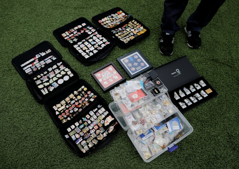 Yoshiyuki Terajima, a pin collector based in Tokyo, displays his