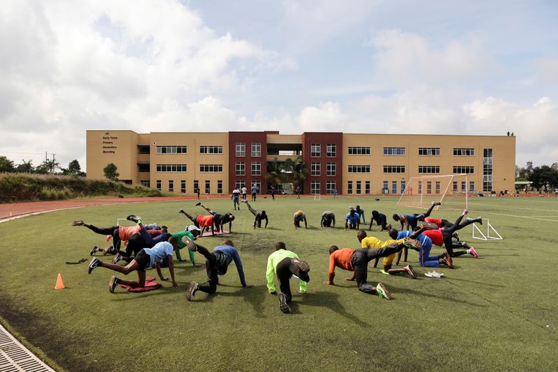 FILE PHOTO: Kenyan athletes warm up before a training session