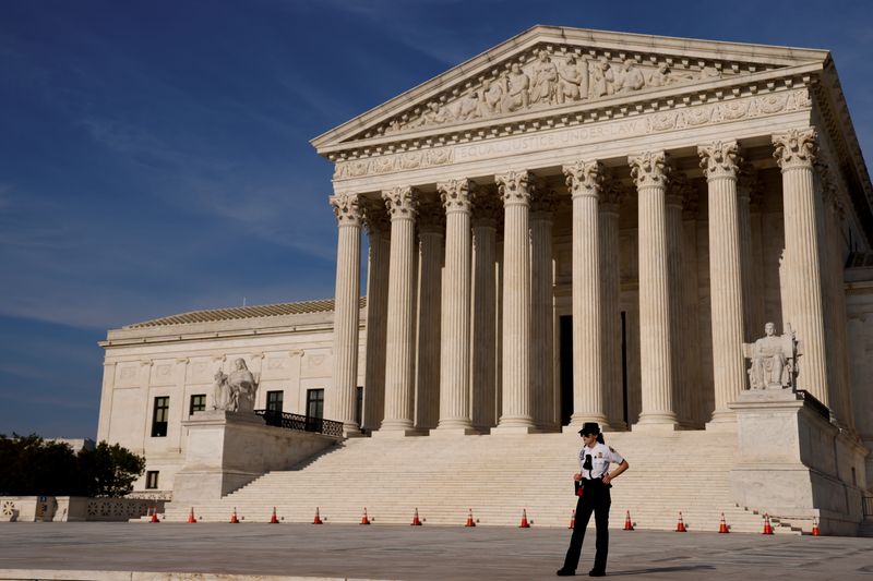 FILE PHOTO: A U.S. Supreme Court police officer patrols the