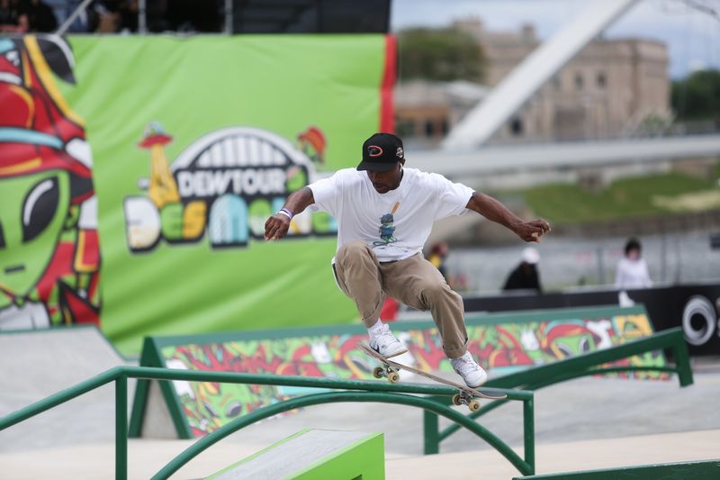 Skateboarders practice during a stop on the Dew Tour in
