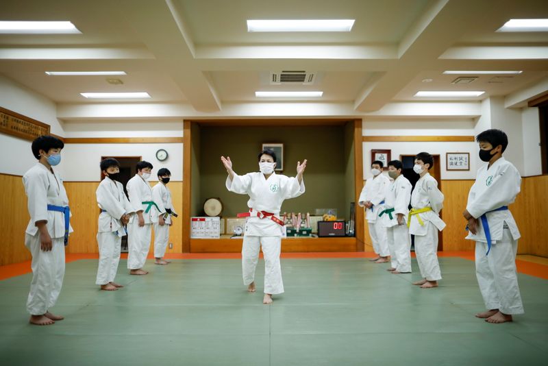 Akiko Amano teaches judo for her students in amid the