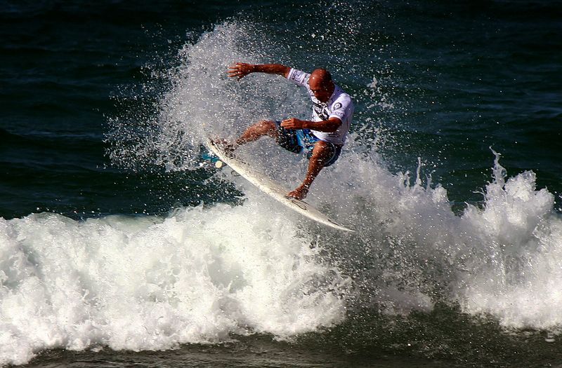 FILE PHOTO: Kelly Slater rides a wave during a promotional