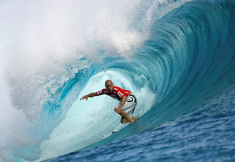 FILE PHOTO: Surfer Slater of the U.S rides a wave