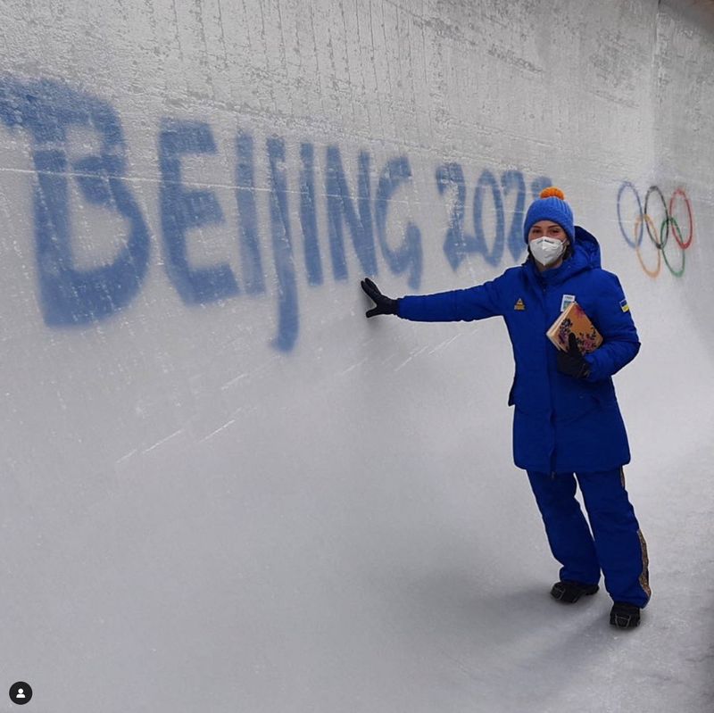 Ukrainian bobsledder, Lidiia Hunko, poses on ice next to a