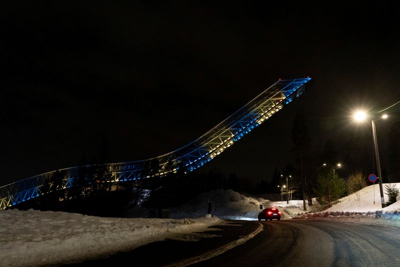 A view of Holmenkollen ski jumping hill lit up in