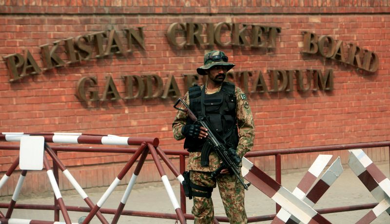 A Pakistani soldier stands guard outside the Gaddafi Cricket Stadium