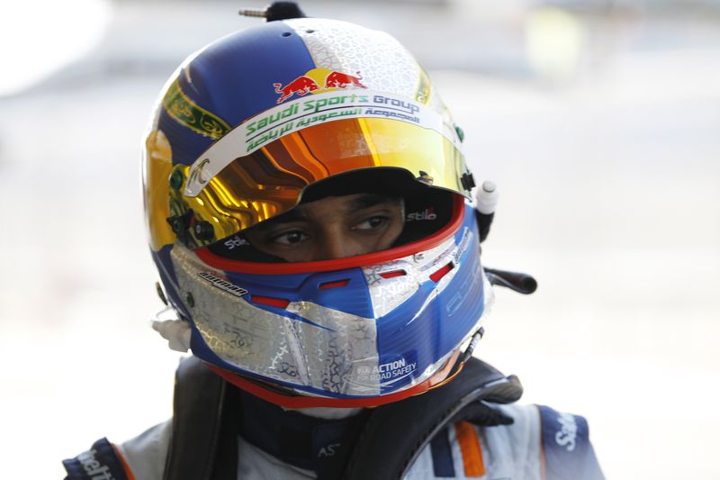 Saudi Prince Al-Faisal of Aston Martin Racing walks towards his