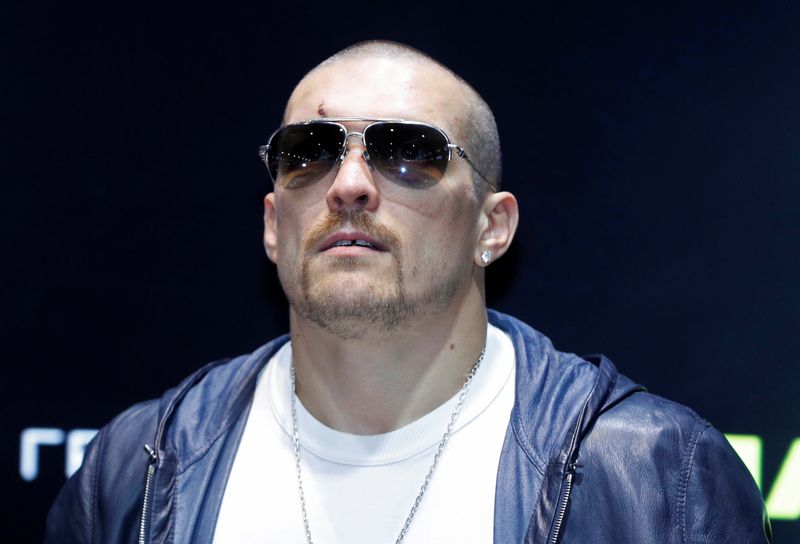 World heavyweight champion Oleksandr Usyk attends a news conference in
