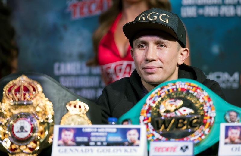 Middleweight boxer Gennady Golovkin of Kazakhstan sits behind his belts