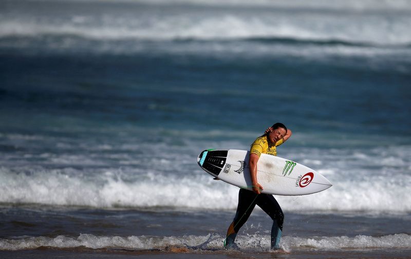 FILE PHOTO: Tyler Wright of Australia leaves the water during