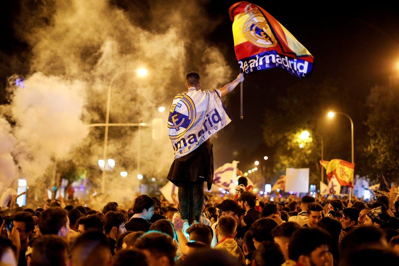 FILE PHOTO: Real Madrid fans celebrate near the Cibeles fountain