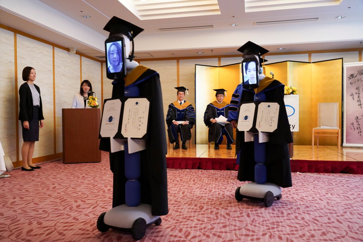 FILE PHOTO: Ipads attached to ‘newme’ robots replacing graduating students’