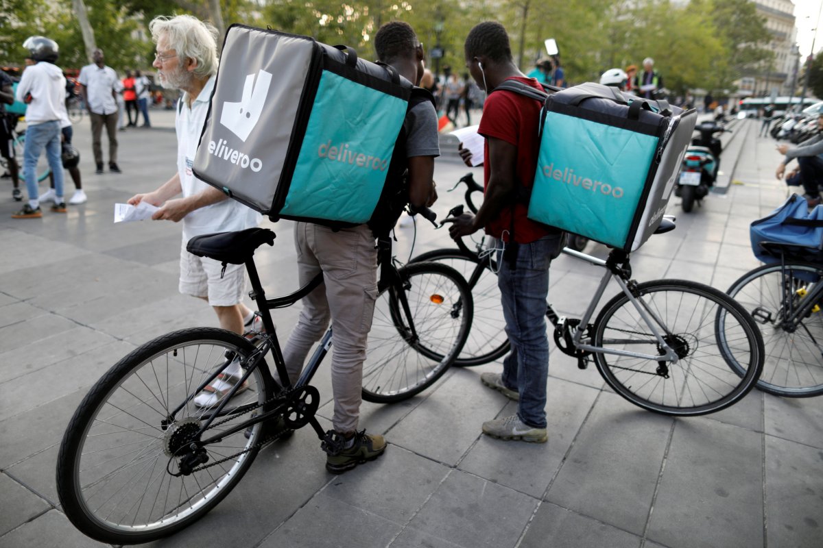 FILE PHOTO: Bikers of food courier service Deliveroo demonstrate as