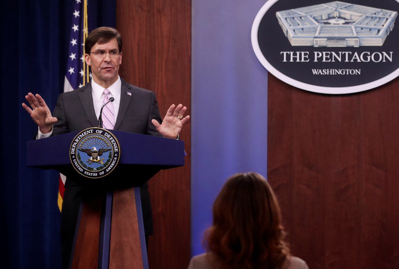 U.S. Defense Secretary Esper and Joint Chiefs Chair Milley hold