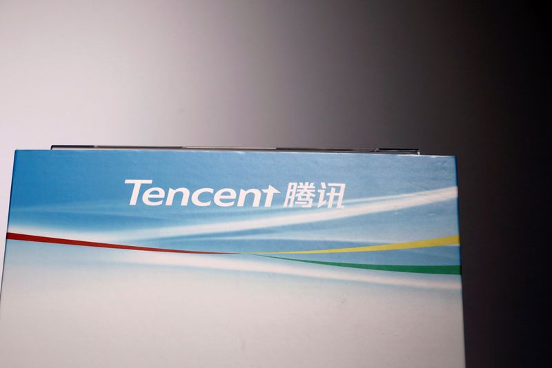 Logo of Tencent is displayed at a news conference in