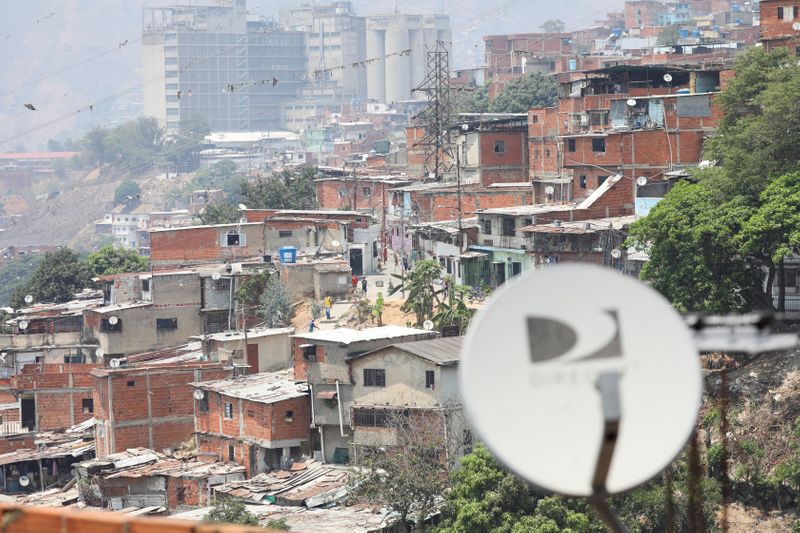Satellite tv antennas are seen in the low-income neighbourhood Catia