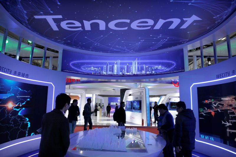 People visit Tencent’s booth at the World 5G Exhibition in