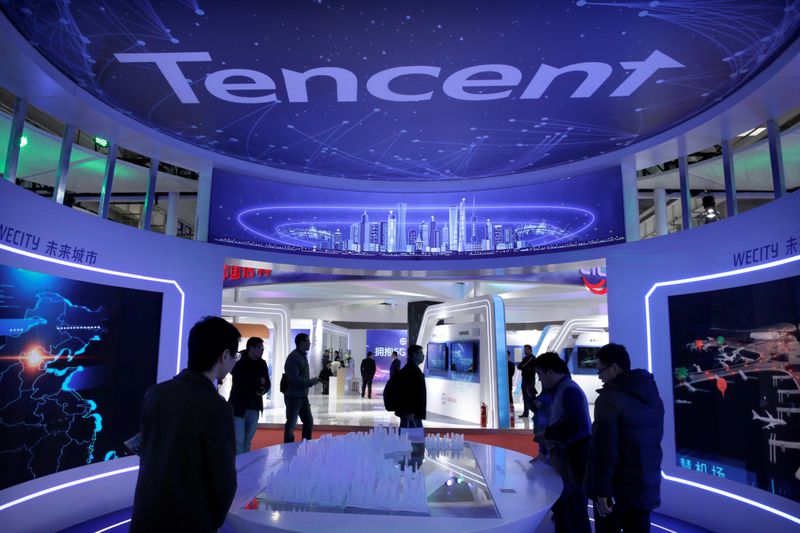People visit Tencent’s booth at the World 5G Exhibition in