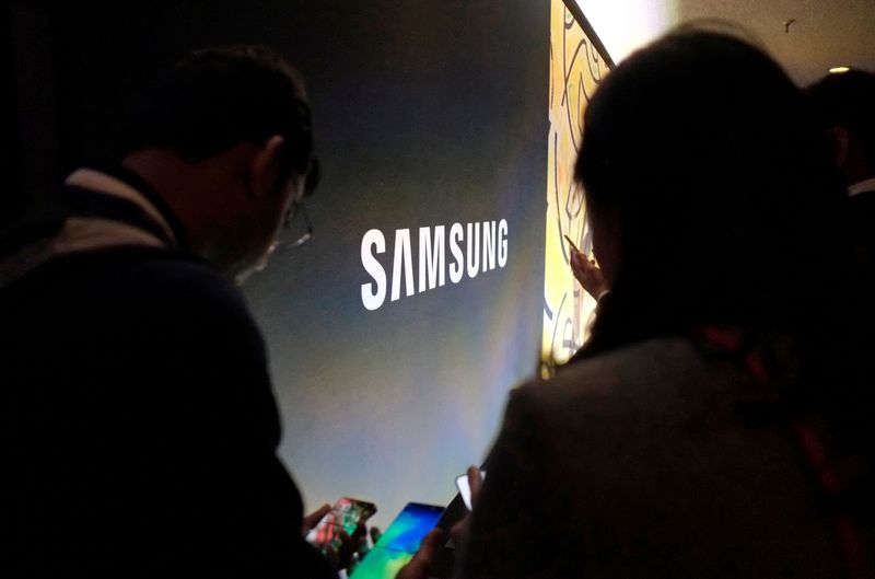 Attendees at Samsung Electronics Co Ltd’s Unpacked event test out