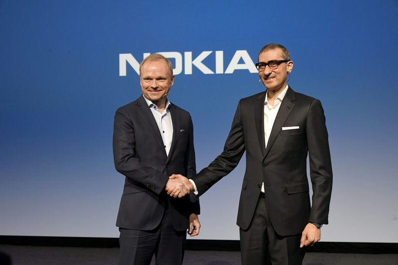 Nokia’s new President and CEO Pekka Lundmark shakes hands with