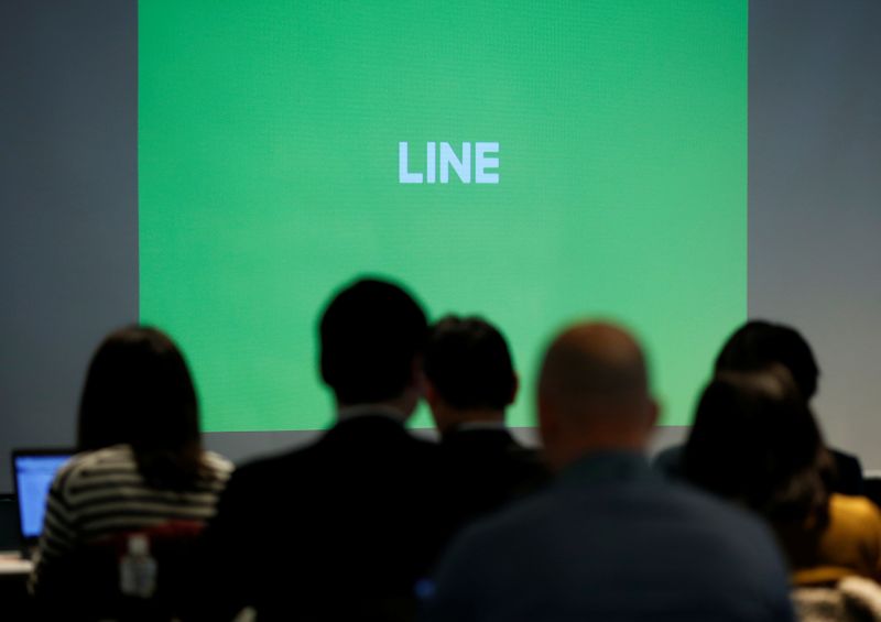 Logo of Line Corp is seen on a screen during