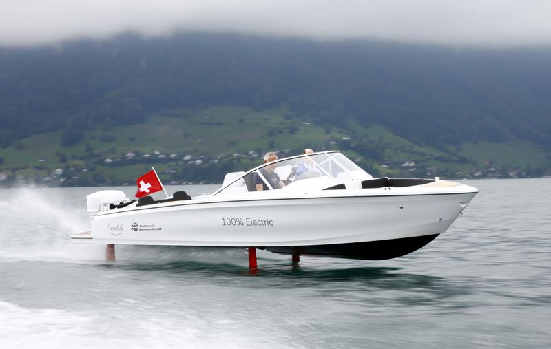 Vogel steers electric powered Candela Seven boat on Lake Lucerne