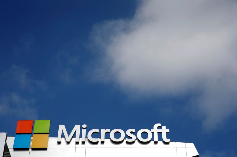 A Microsoft logo is seen next to a cloud in